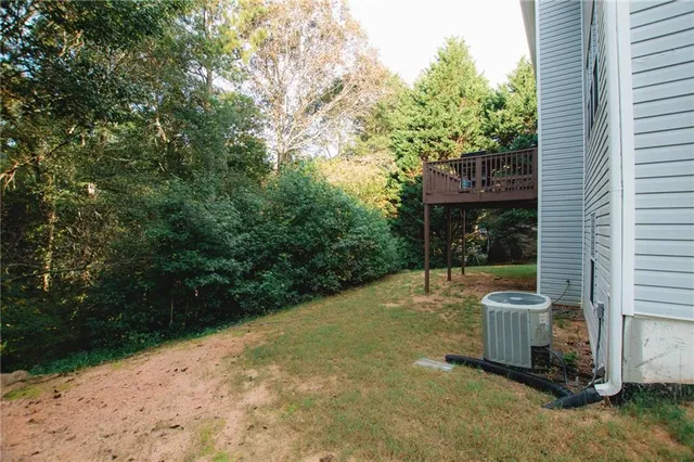 a view of a chair and table in the backyard