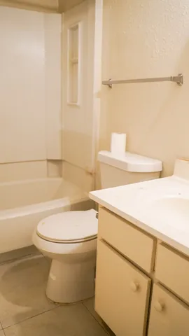 a front view of a building with trees