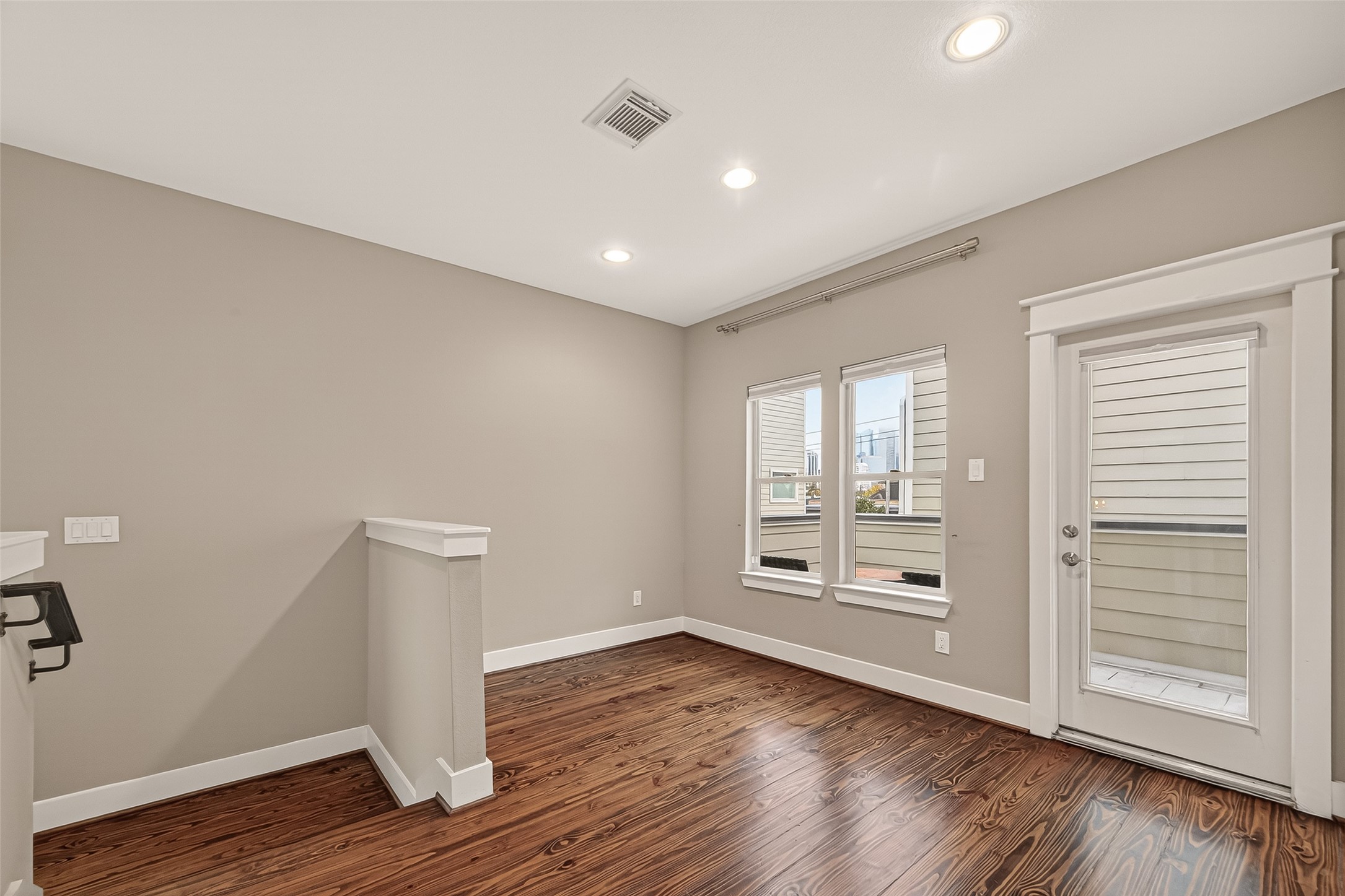 1510 Crockett Street, Unit B Houston, TX 77007 - Photo 20 of 32 wooden floor in an empty room with a window
