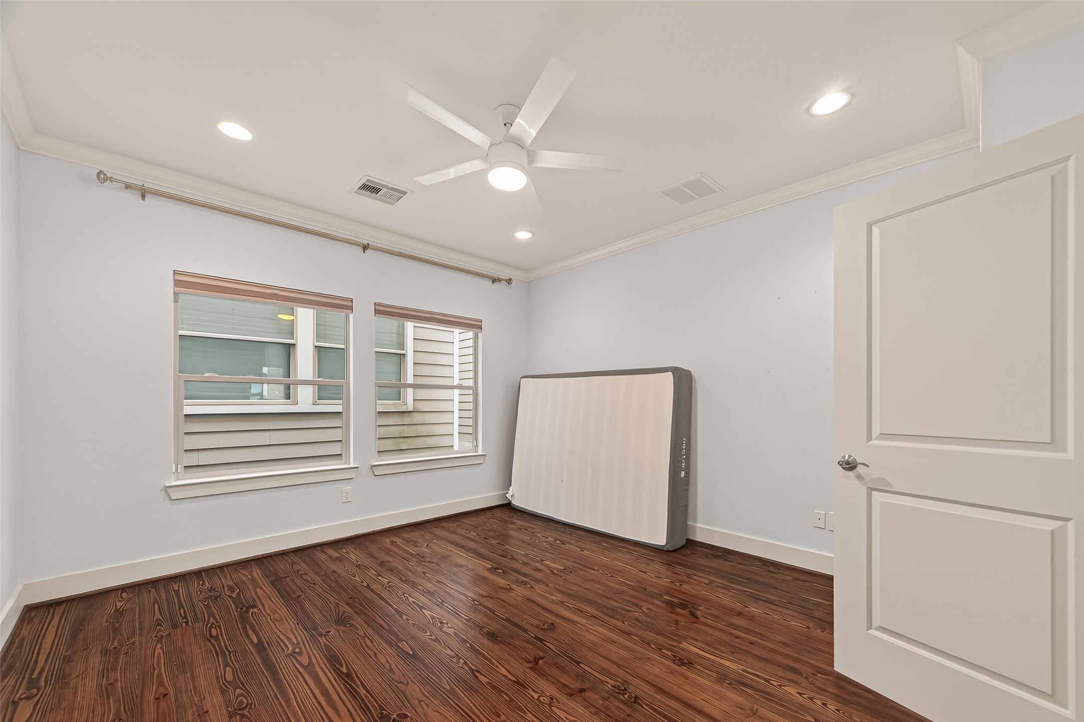 1510 Crockett Street, Unit B Houston, TX 77007 - Photo 24 of 32 a view of empty room with wooden floor and fan