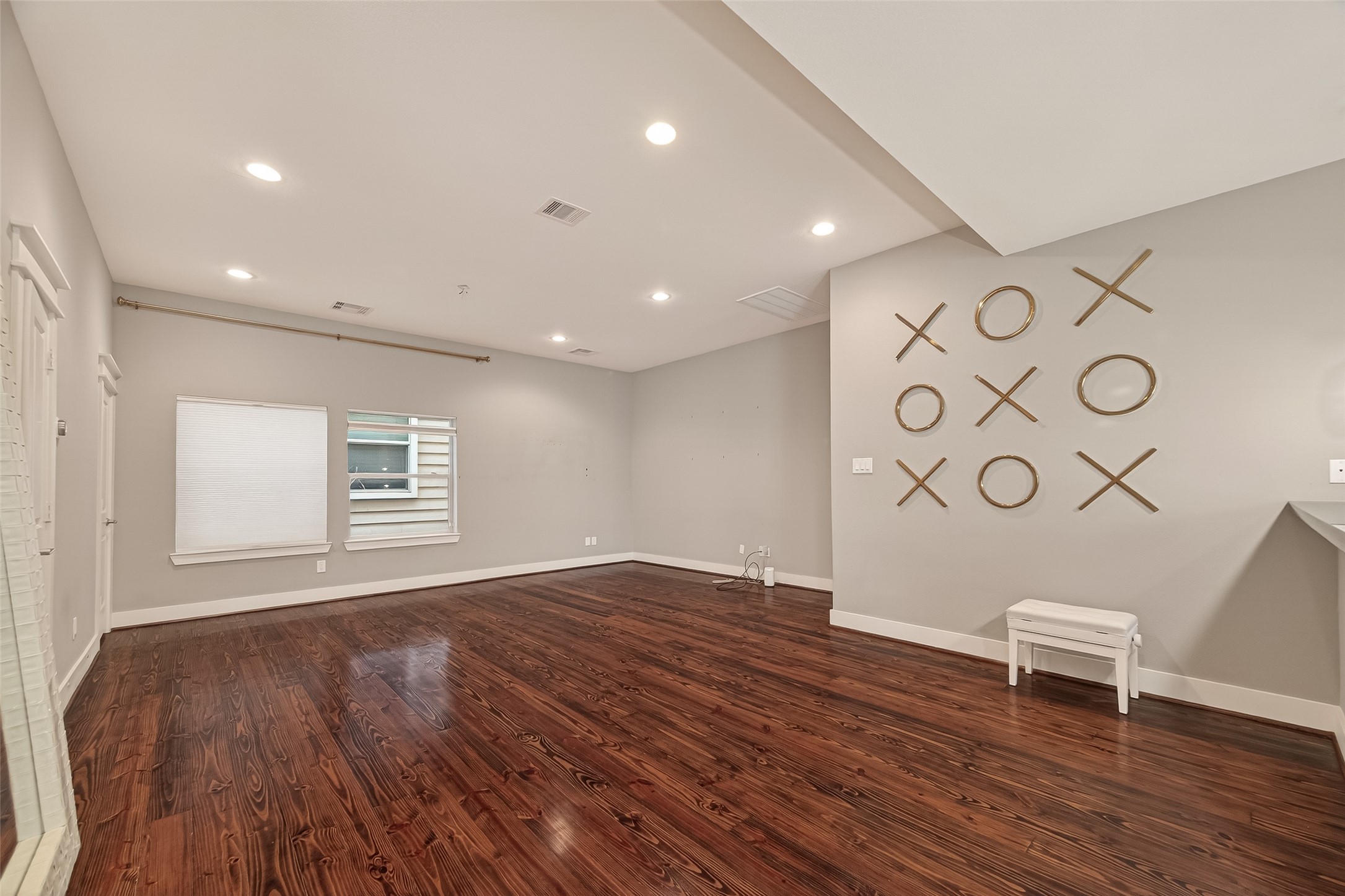1510 Crockett Street, Unit B Houston, TX 77007 - Photo 5 of 32 a view of an empty room with a window and wooden floor