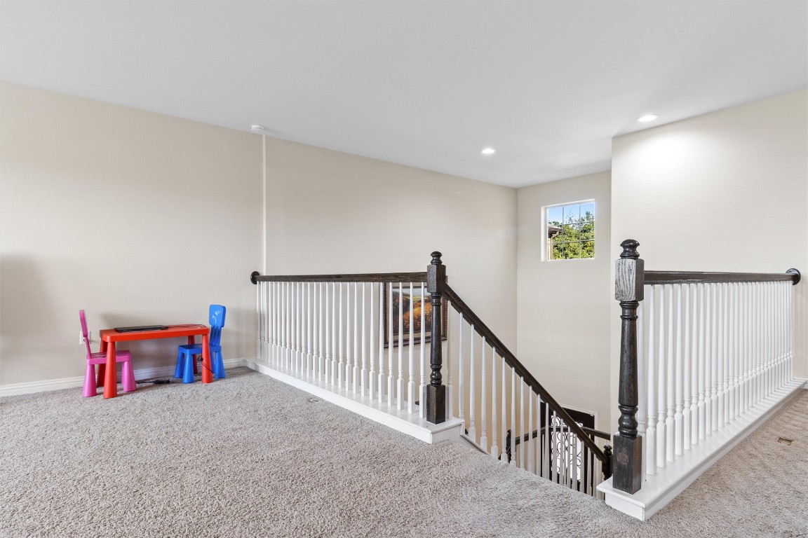 9404 Ocean Going Court Austin, TX 78748 - Photo 12 of 40 a view of a hallway with staircase