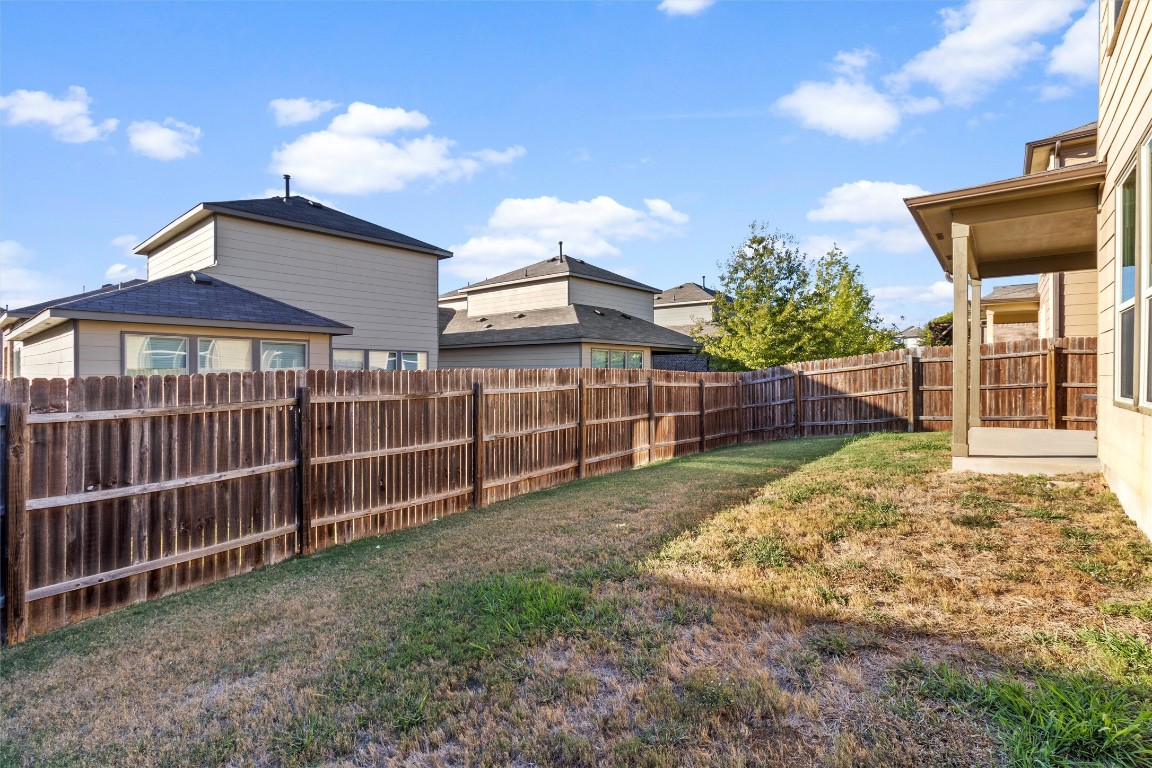 9404 Ocean Going Court Austin, TX 78748 - Photo 34 of 40 a view of a backyard with wooden fence