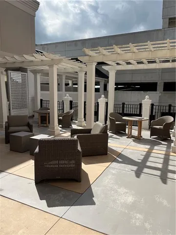 a view of a lobby with furniture and fireplace