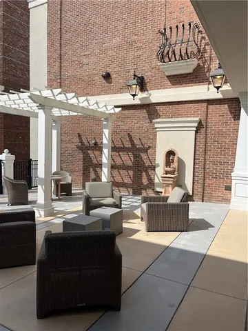 a living room with fireplace furniture and a fireplace