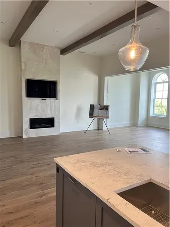 a view of a kitchen with a sink and dishwasher