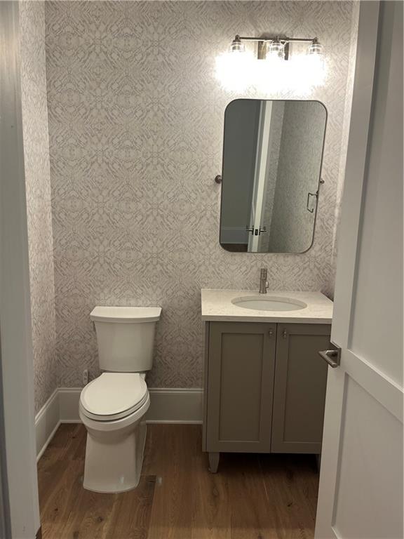 106 Spring Street Gainesville, GA 30501 - Photo 15 of 18 a bathroom with a toilet sink and mirror