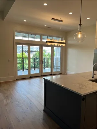 a large room with wooden floor and large window