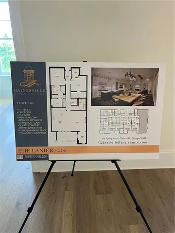 a view of a room with painting on the wall