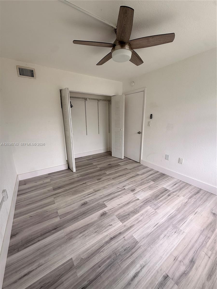 10875 Northwest 7th Street, Unit 1136 Miami, FL 33172 - Photo 13 of 25 a view of an empty room
