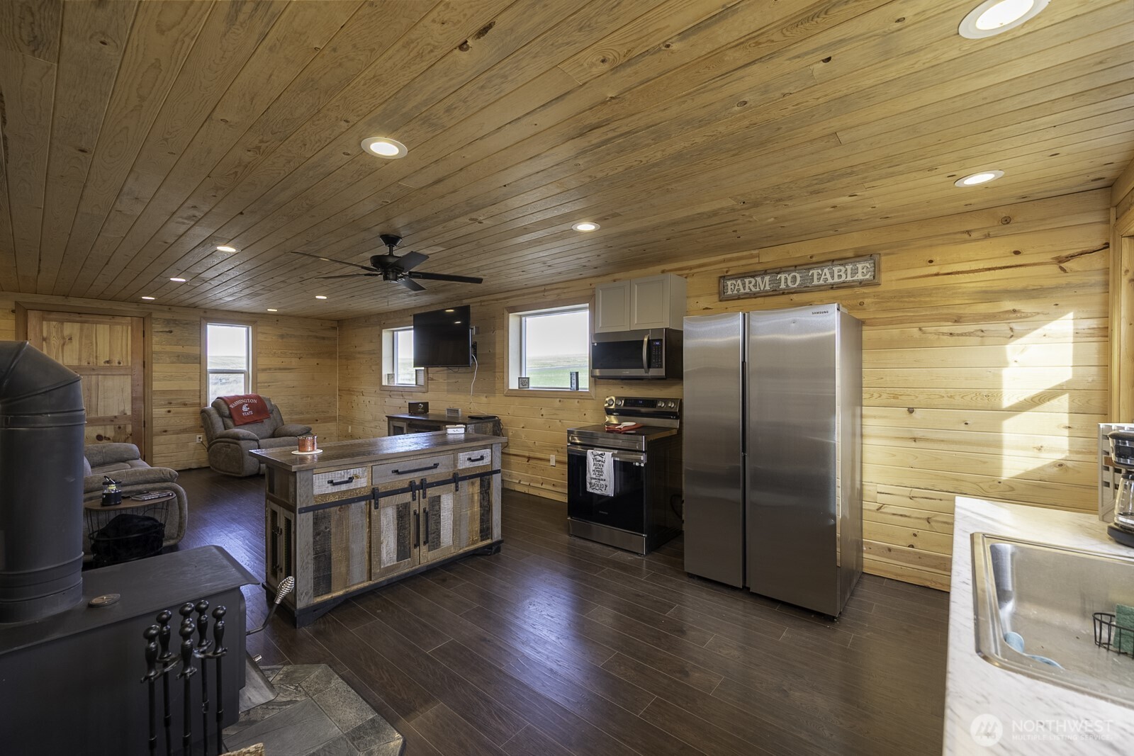 32244 Mohler Road East Mohler, WA 99154 - Photo 28 of 35 a kitchen with stainless steel appliances granite countertop a refrigerator a stove and a sink