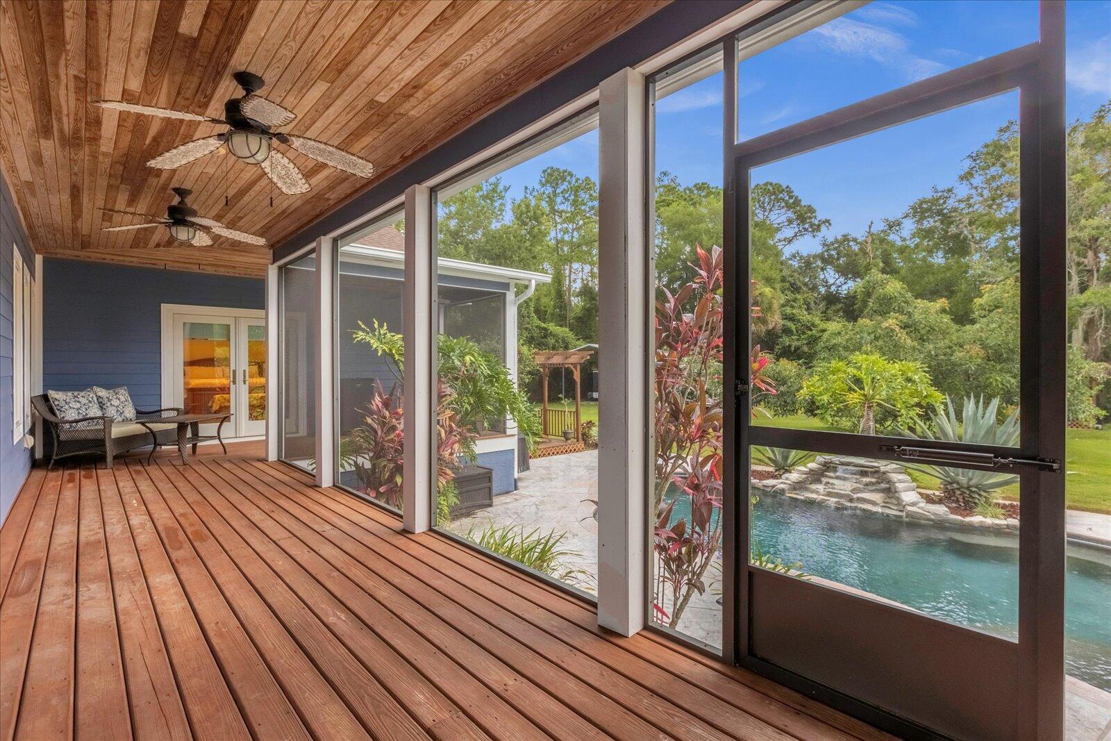 4349 Hunter Road Mims, FL 32754 - Photo 27 of 36 Screened back porch