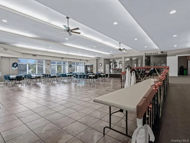 a view of a swimming pool and furniture