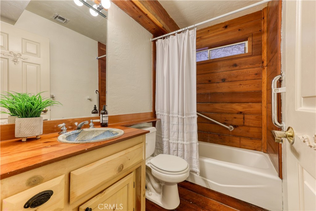 564 Croyden Lane Cambria, CA 93428 - Photo 39 of 64 a bathroom with a granite countertop sink toilet and shower