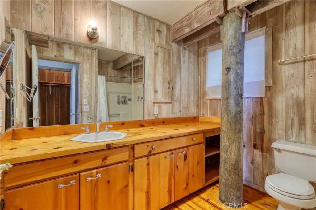 564 Croyden Lane Cambria, CA 93428 - Photo 52 of 64 a bathroom with a granite countertop sink toilet and shower