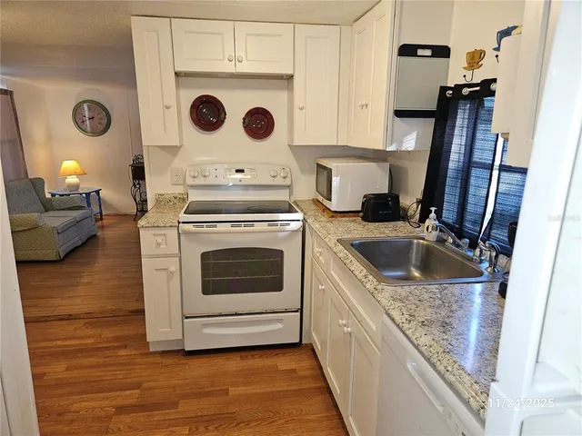 a kitchen with a stove and a sink