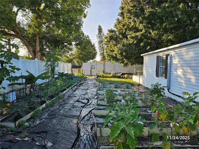 a backyard of a house with lots of green space
