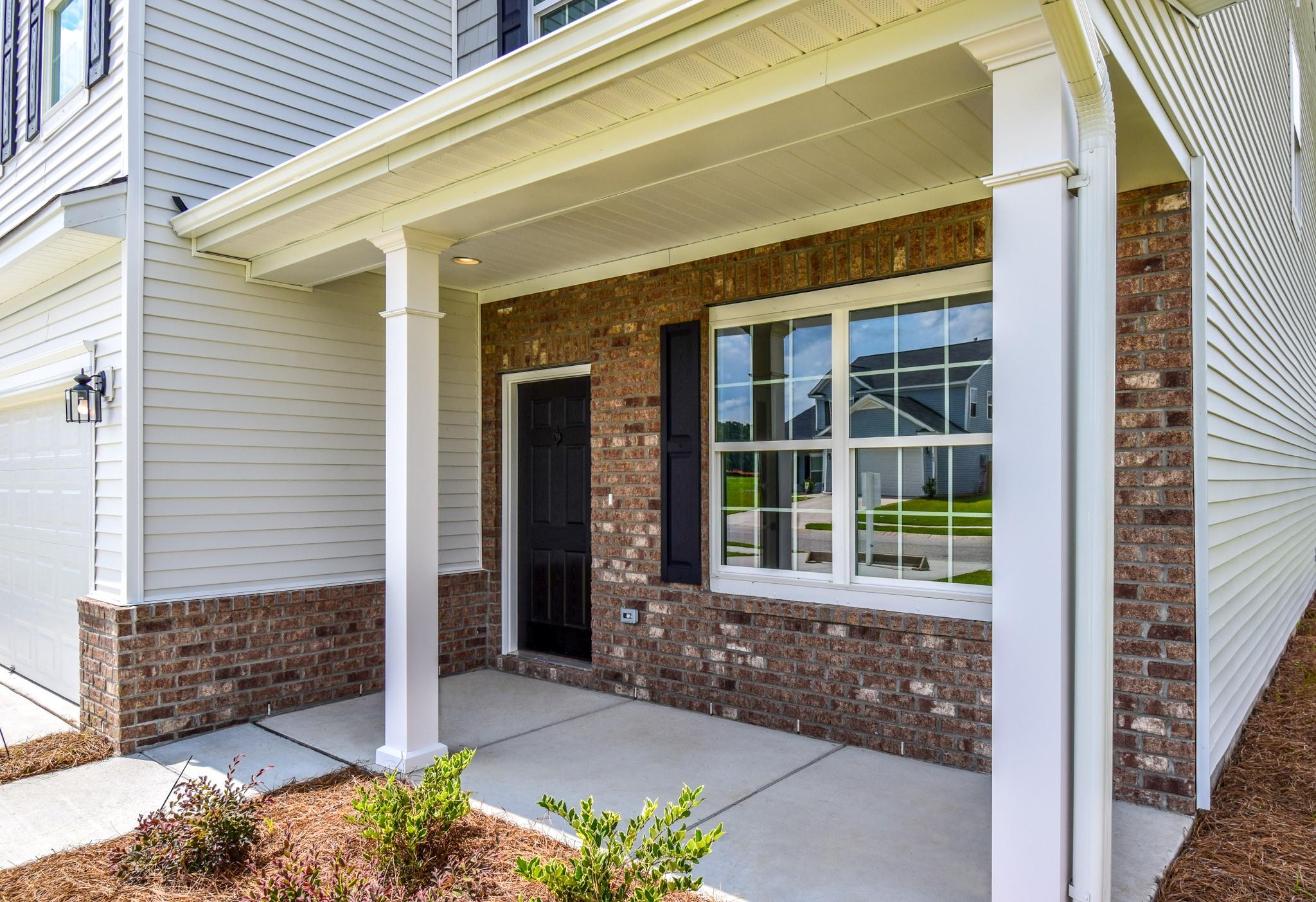 306 Silverleaf Lane Moncks Corner, SC 29461 - Photo 3 of 28 Inviting Covered Porch