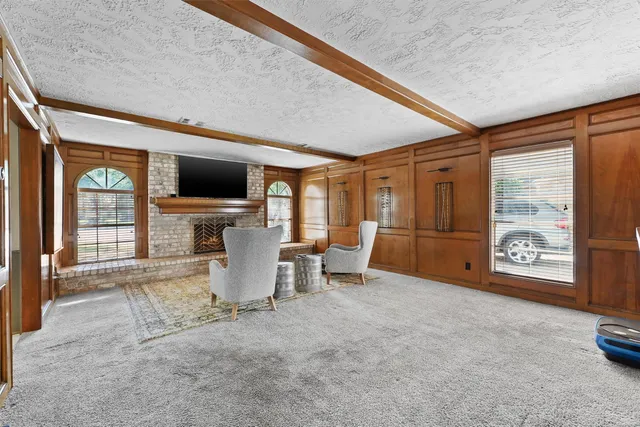 a room with furniture and a flat screen tv