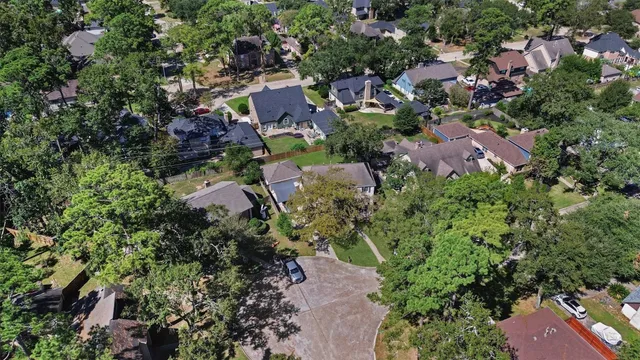 a view of a yard with a big yard and potted plants