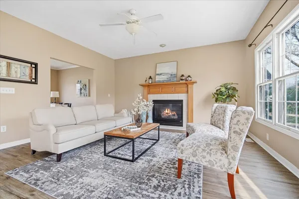 a living room with furniture and a fireplace