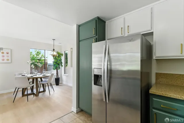 a bedroom with a bed and a night stand