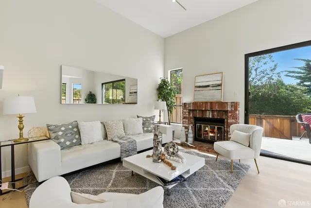 a view of a dining room with a table and chairs