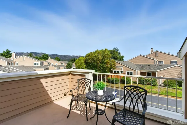 a kitchen with stainless steel appliances granite countertop a refrigerator and a stove