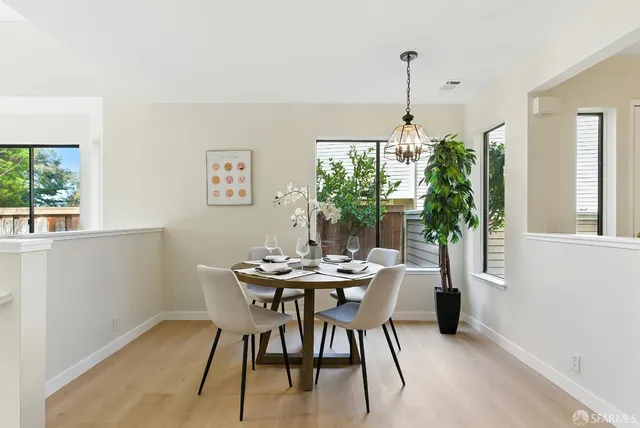 a kitchen with stainless steel appliances granite countertop a refrigerator stove and sink