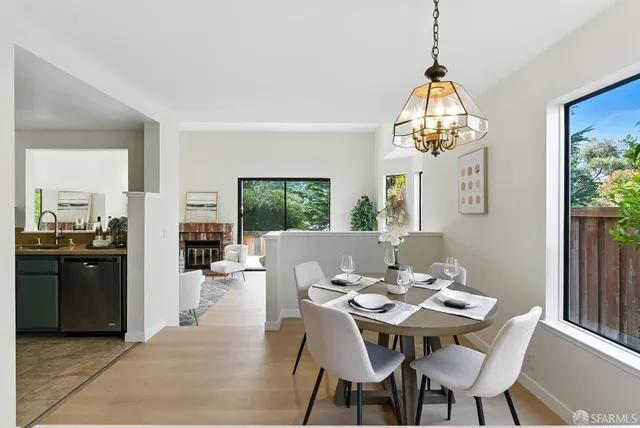 a kitchen with sink a stove and cabinets