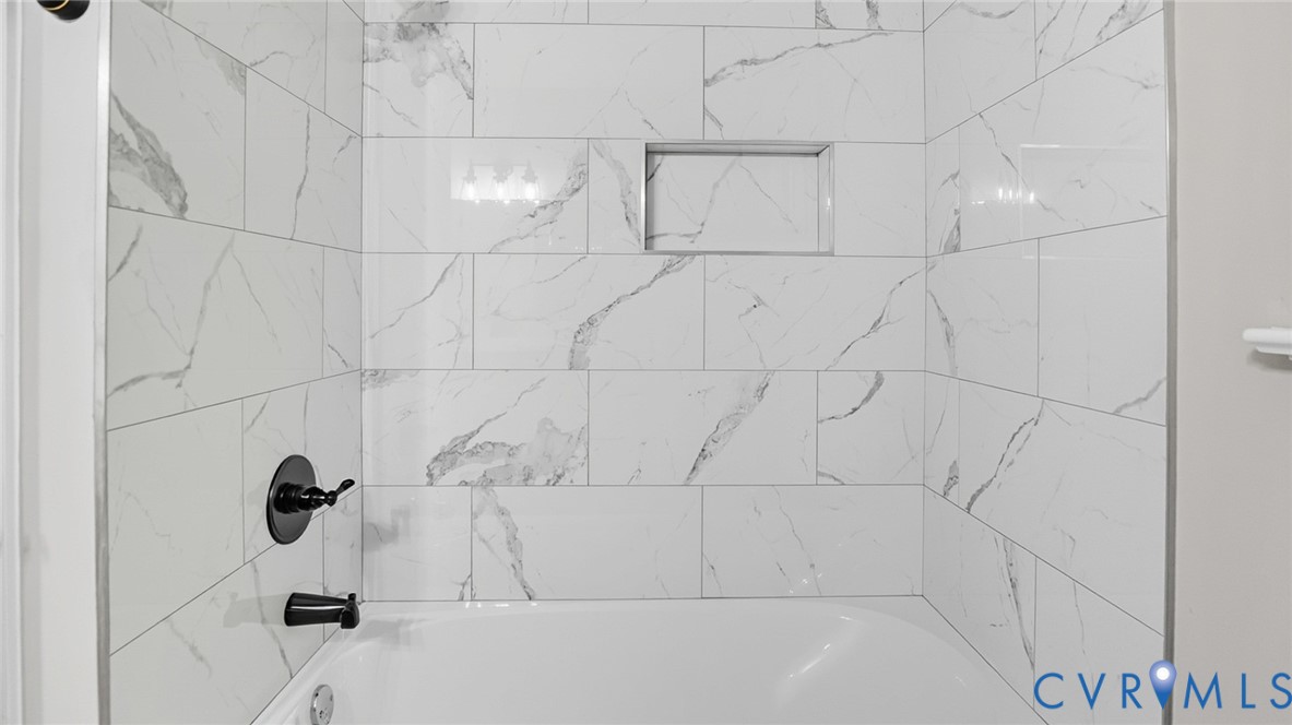 7508 Lantern Ridge Court Chesterfield, VA 23832 - Photo 35 of 38 new tub and tile surround in hall bath