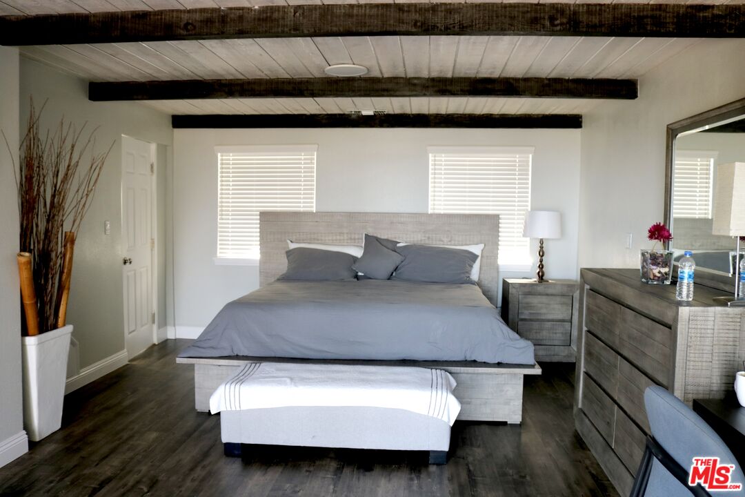 50 Rockinghorse Road Rancho Palos Verdes, CA 90275 - Photo 5 of 18 a bedroom with a bed and wooden floor