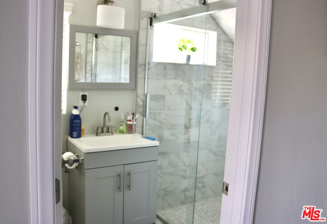 50 Rockinghorse Road Rancho Palos Verdes, CA 90275 - Photo 6 of 18 a bathroom with a sink a vanity and a mirror
