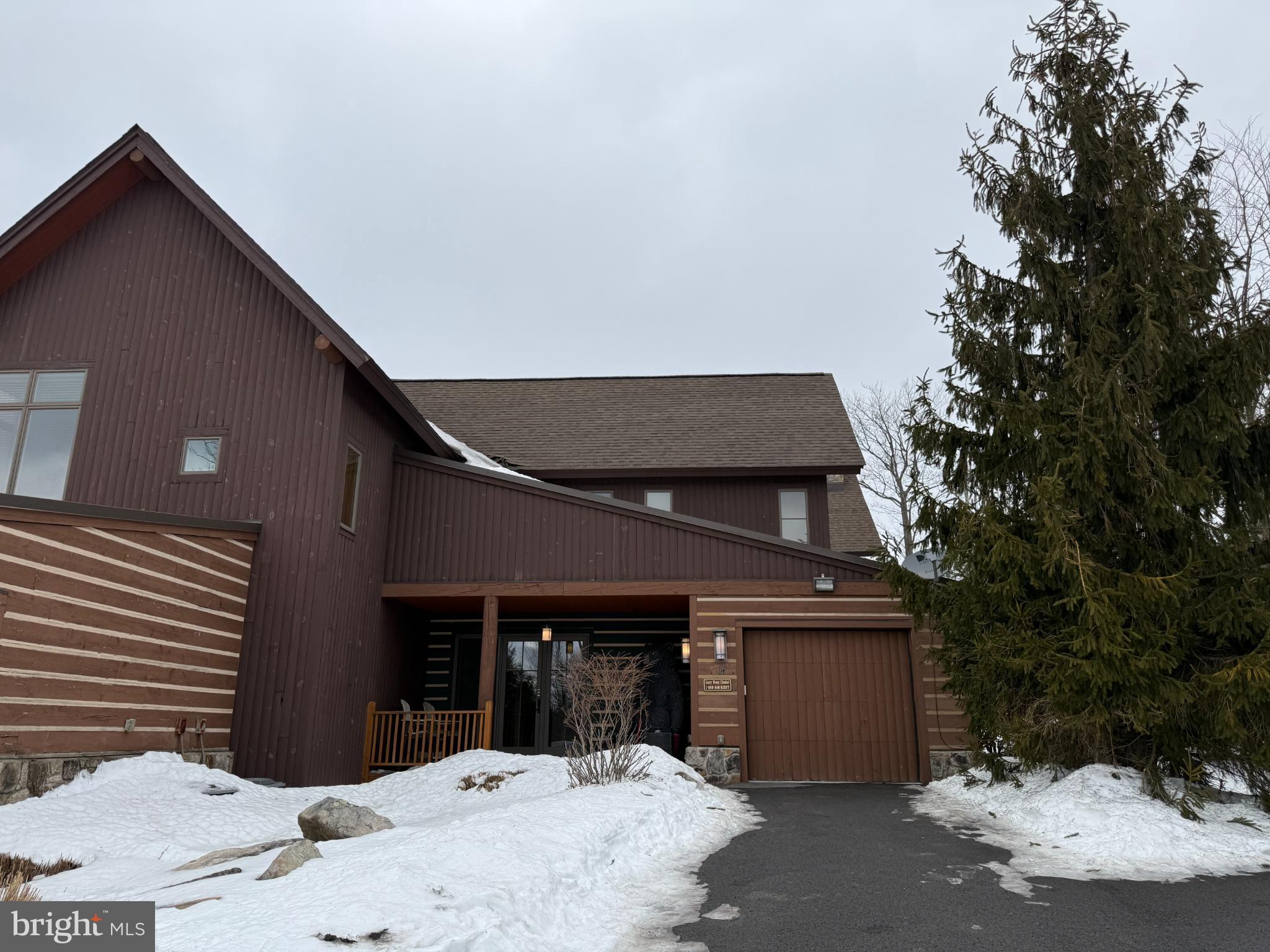 Charming chalet nestled in a snowy landscape.
