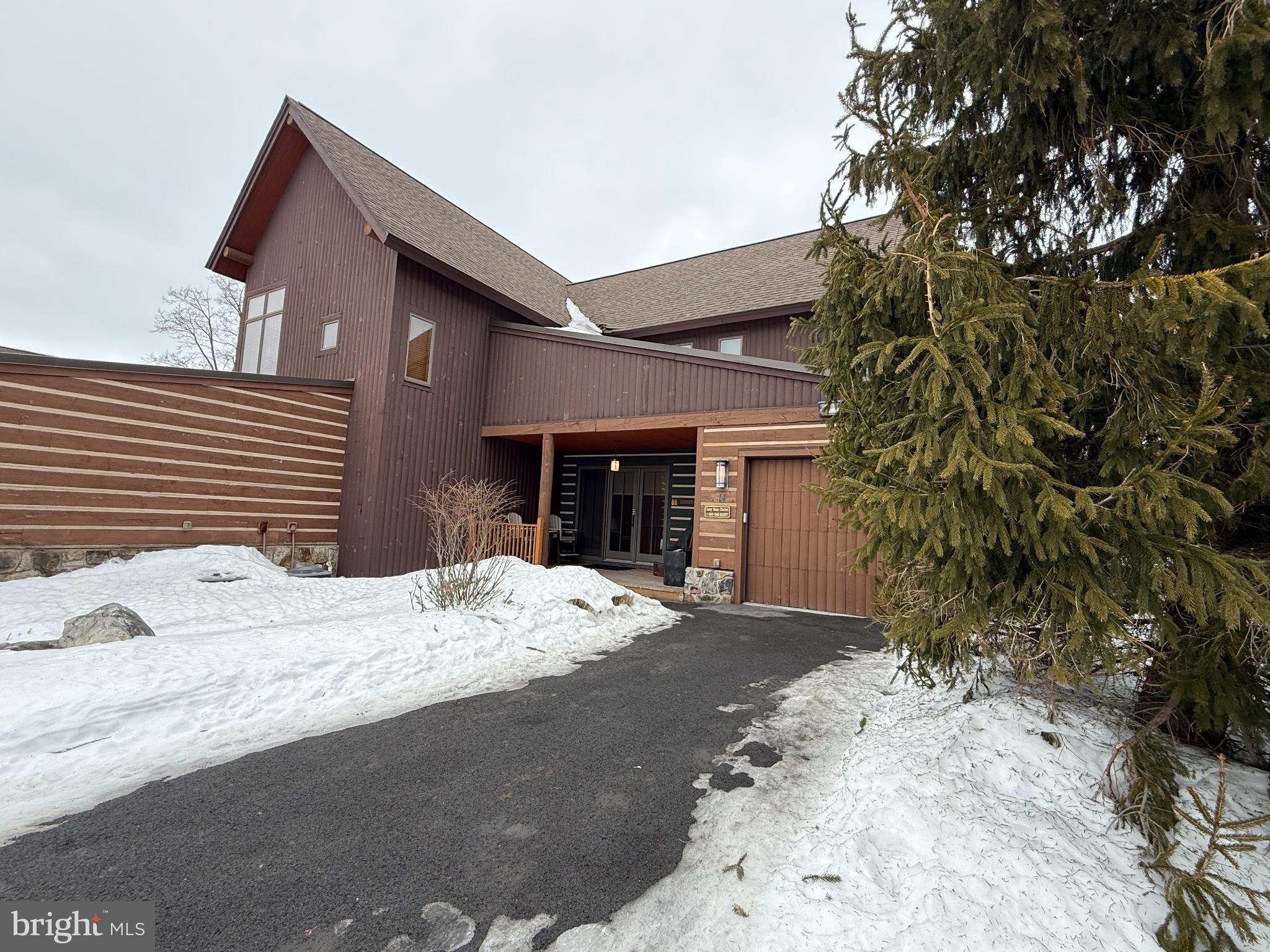 14 North Ridge Road, Unit 18 McHenry, MD 21541 - Photo 2 of 8 Charming modern home nestled in winter's embrace.
