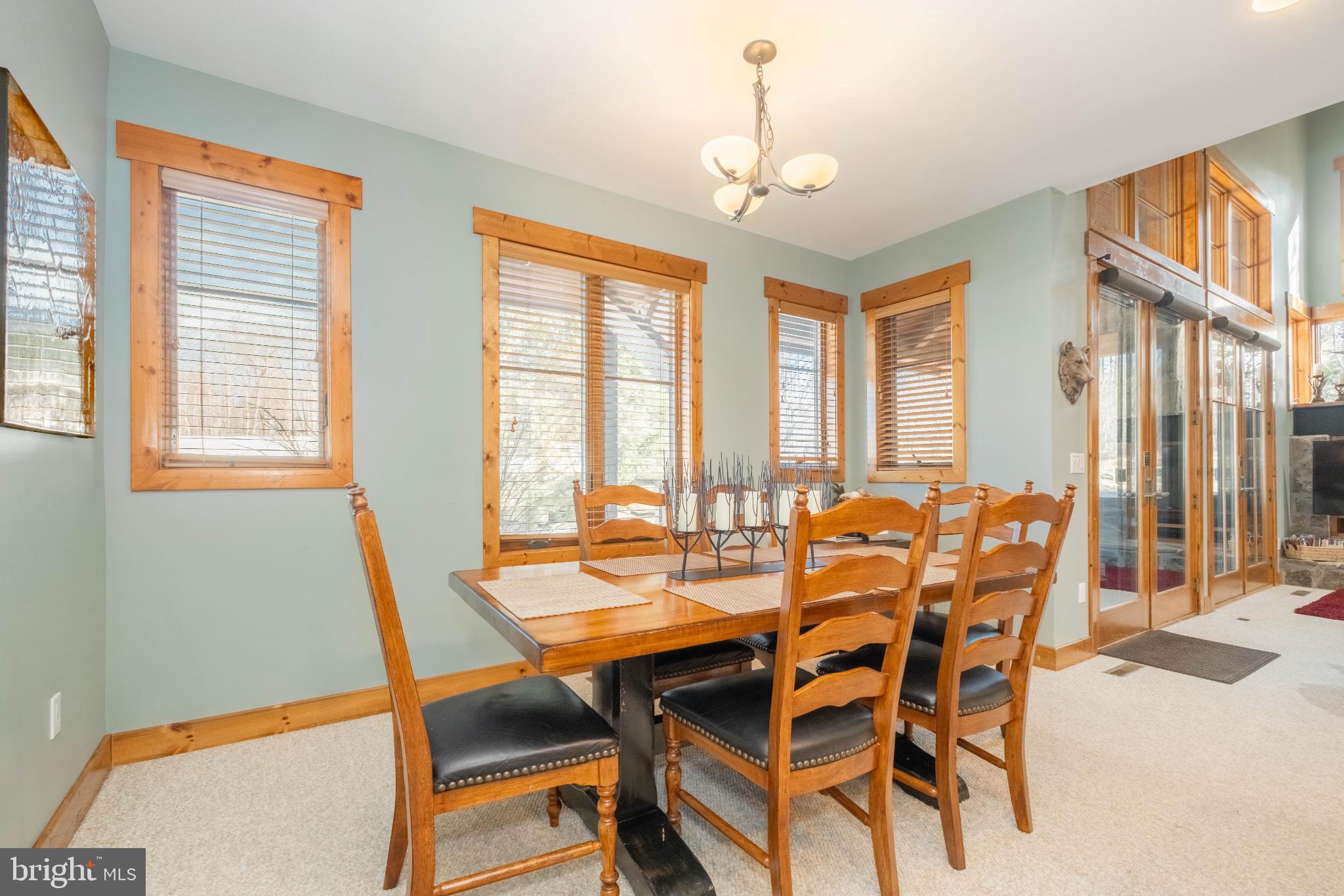 14 Ridge Run Road McHenry, MD 21541 - Photo 20 of 65 a dining room with furniture a chandelier and wooden floor