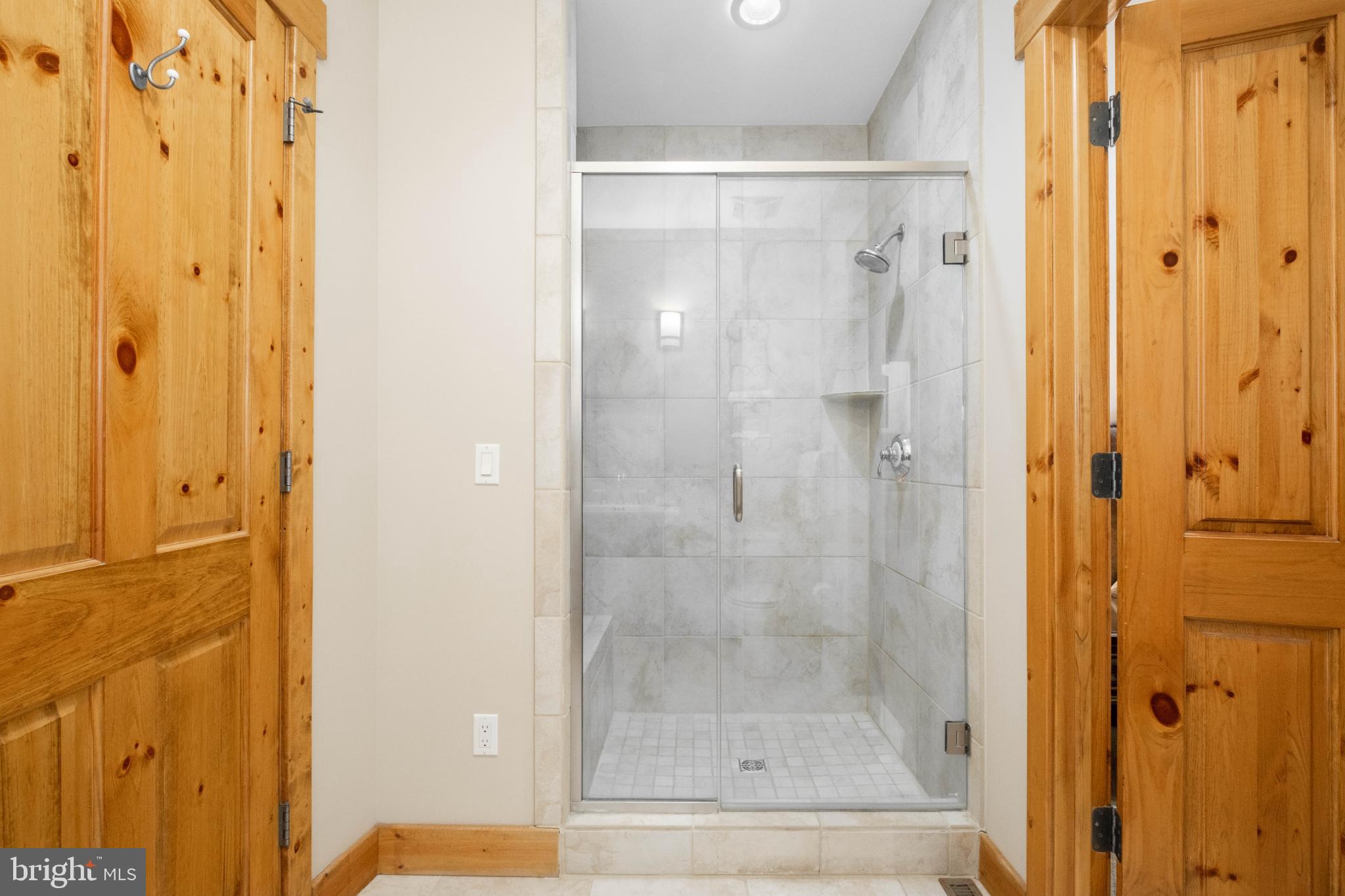 14 Ridge Run Road McHenry, MD 21541 - Photo 25 of 65 a bathroom with a glass shower door