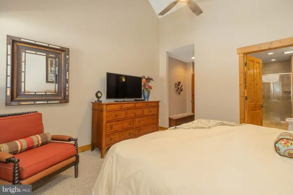 a bedroom with a bed and a couch