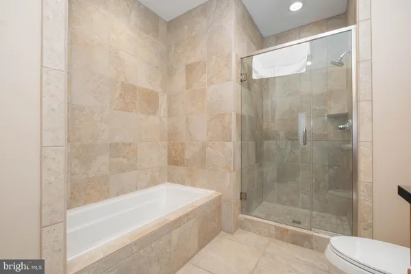 a bathroom with a shower and bathtub