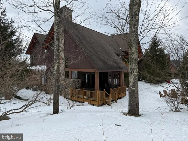 a view of a house with a tree