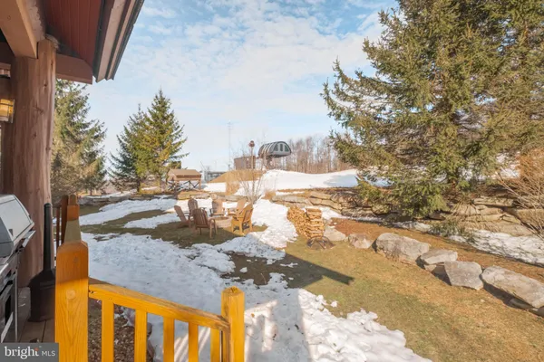a view of a patio in a backyard