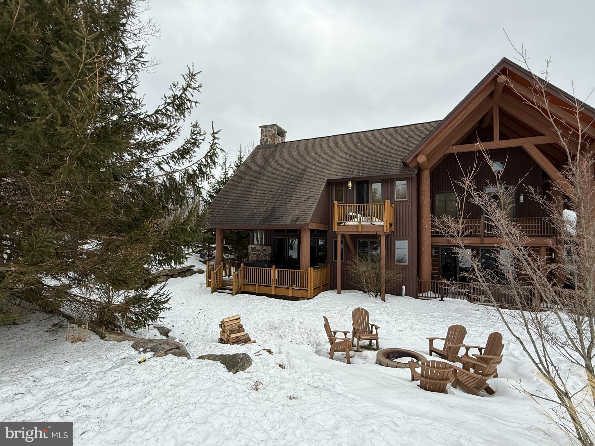 14 North Ridge Road, Unit 18 McHenry, MD 21541 - Photo 7 of 8 Charming lodge nestled in winter's embrace.