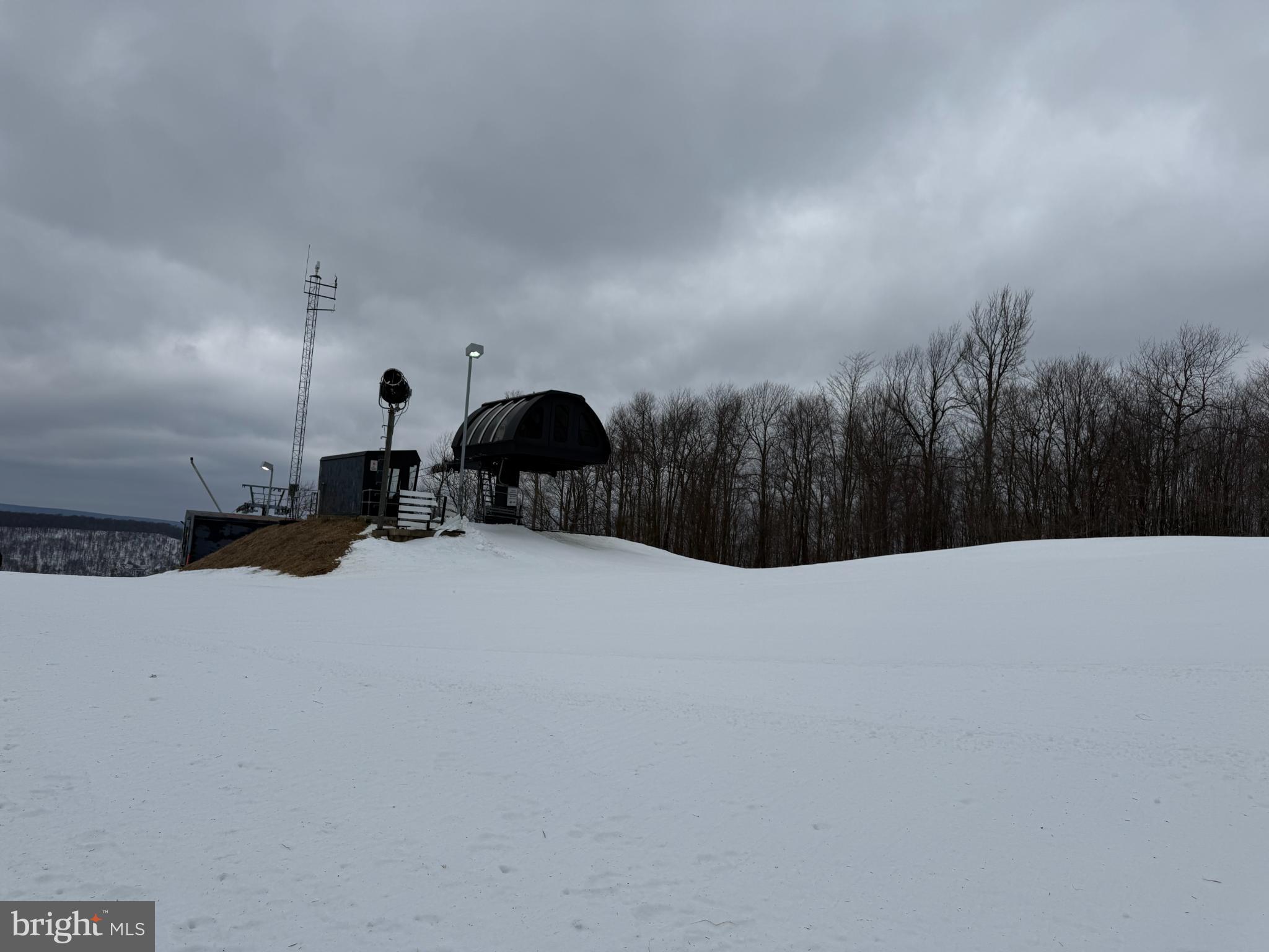 14 North Ridge Road, Unit 18 McHenry, MD 21541 - Photo 8 of 8 Snowy slopes beneath a moody sky.