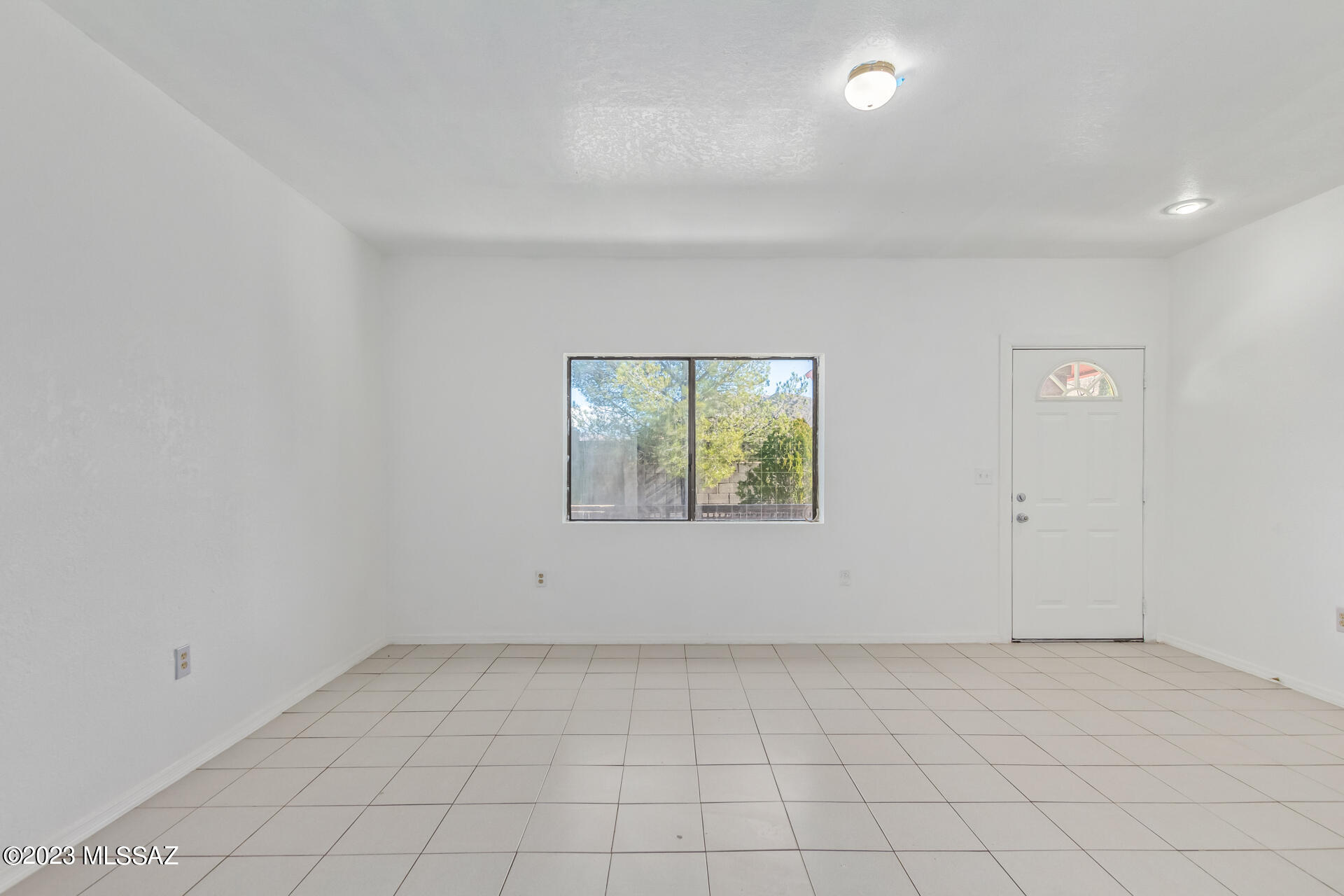 417 Dock Street Rio Rico, AZ 85648 - Photo 8 of 34 an empty room with a empty space and window