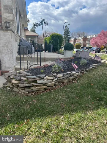 a view of outdoor space with playground and green space