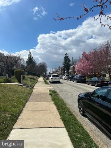 a view of a street with cars on the road
