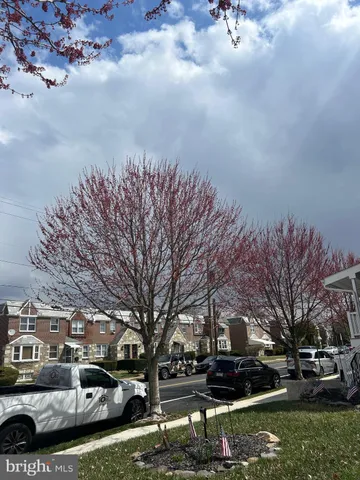 a view of street with parked cars
