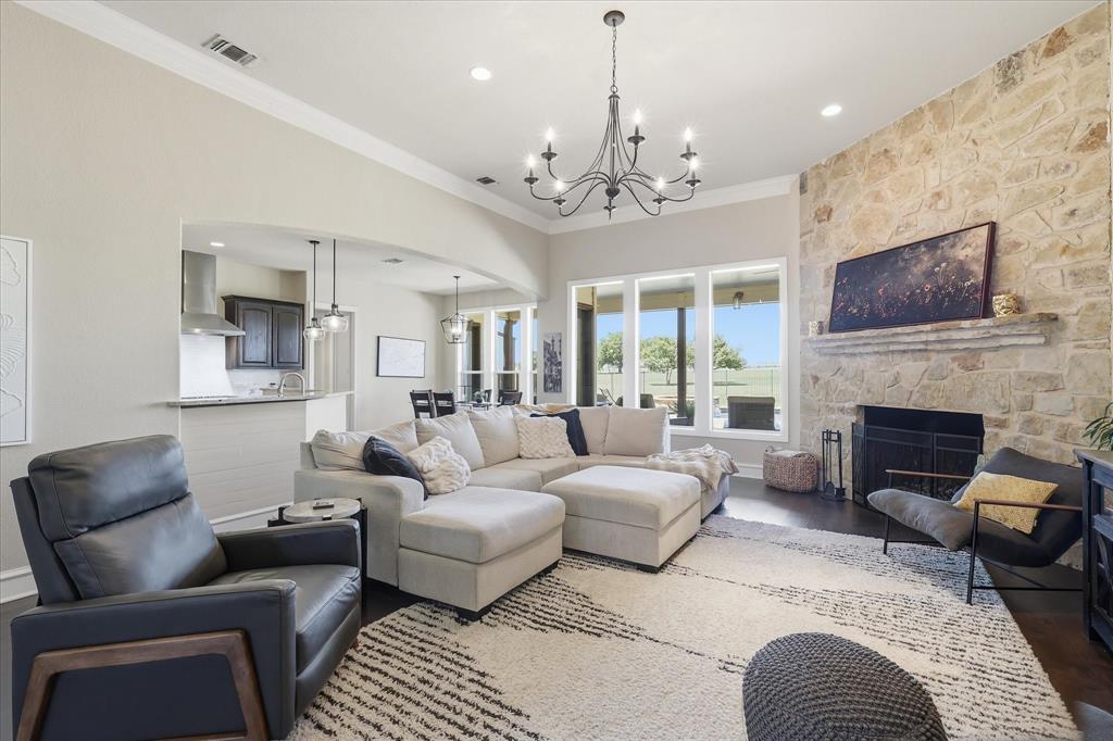 4920 Peden Road Fort Worth, TX 76179 - Photo 5 of 40 Large Living Room with Oversized Fireplace and Chandelier.