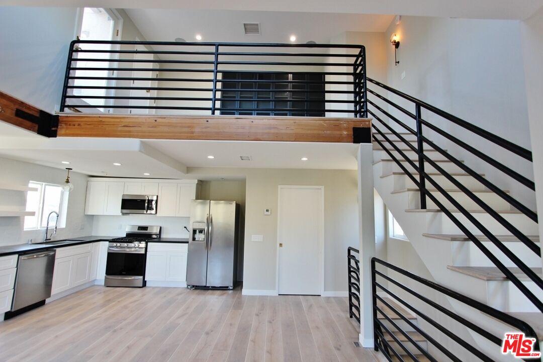 6521 Pacific Avenue Playa del Rey, CA 90293 - Photo 30 of 42 a view of kitchen with granite countertop stainless steel appliances and wooden floor