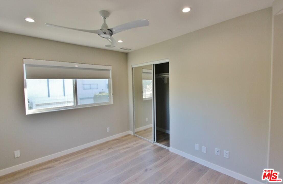 6521 Pacific Avenue Playa del Rey, CA 90293 - Photo 34 of 42 a view of an empty room with wooden floor and a window